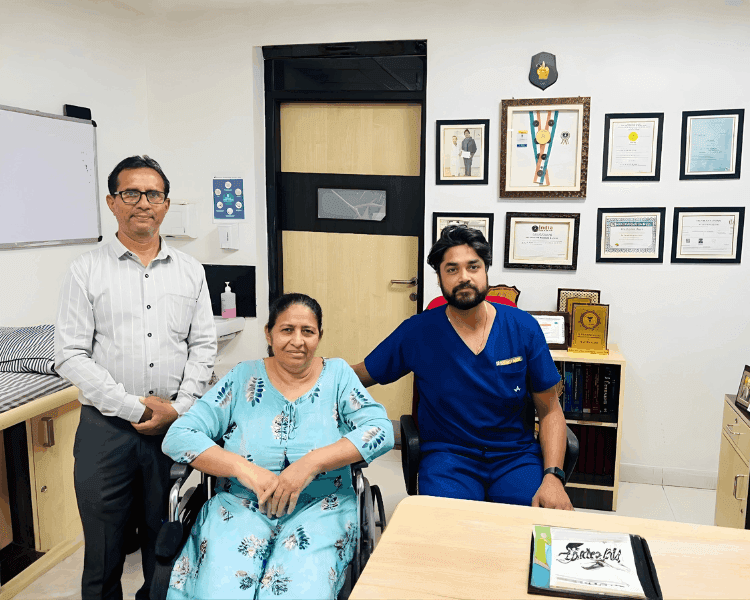 With a patient and family after recovery
